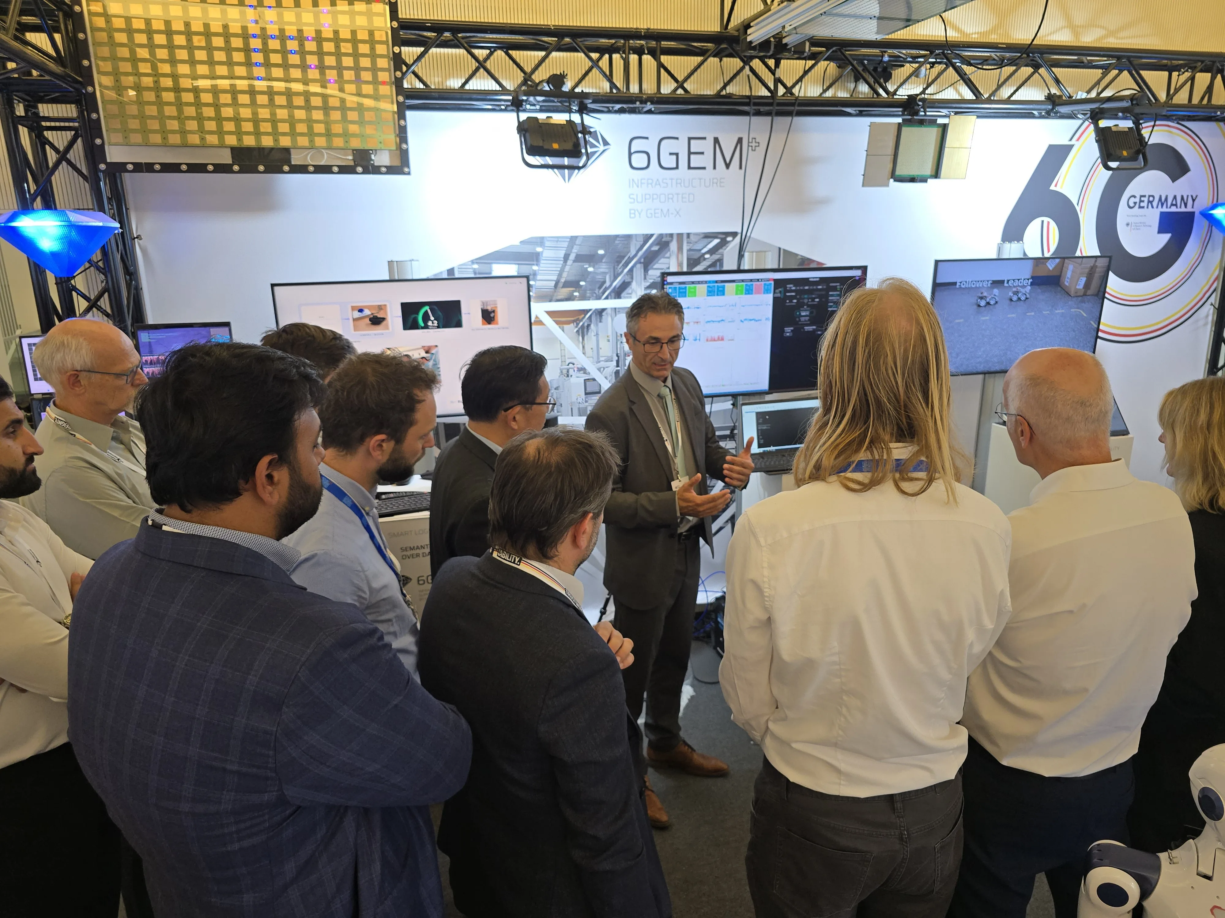 Visitors at the 6GEM+ booths during the Berlin 6G Conference.