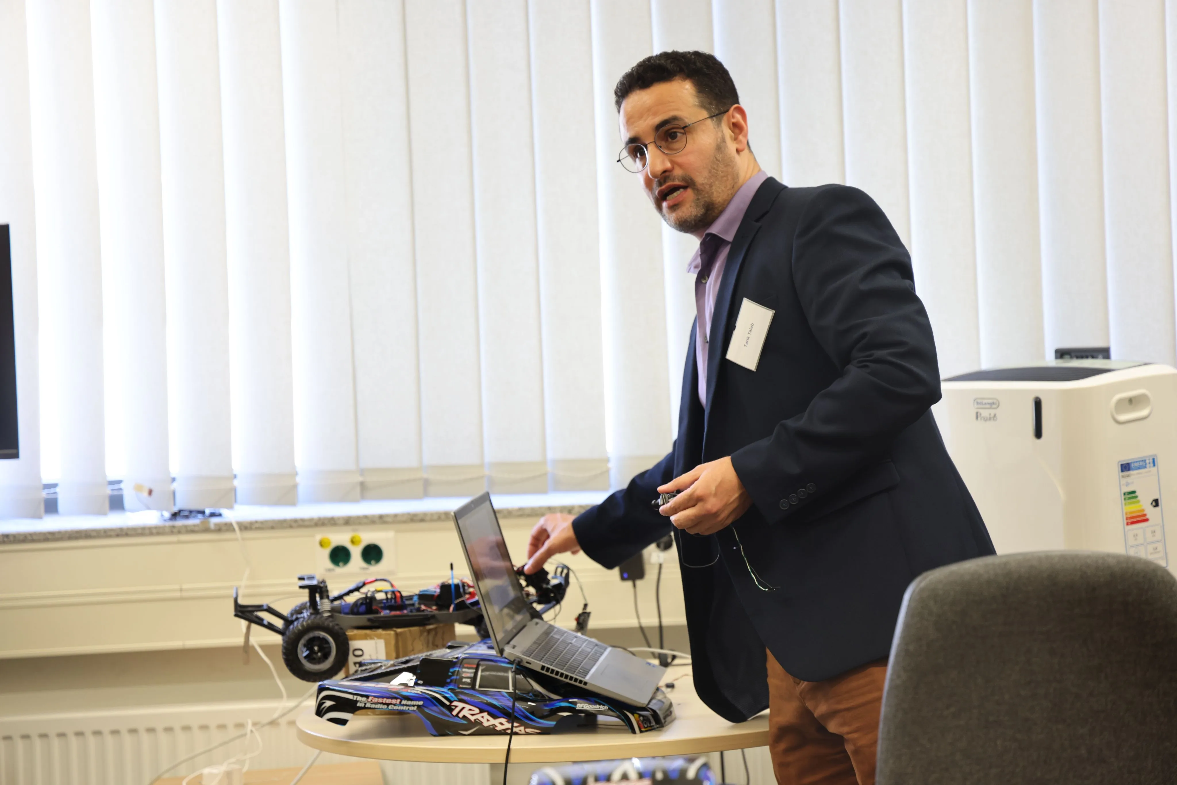 Prof. Tarik Taleb presents research during the lab tour.