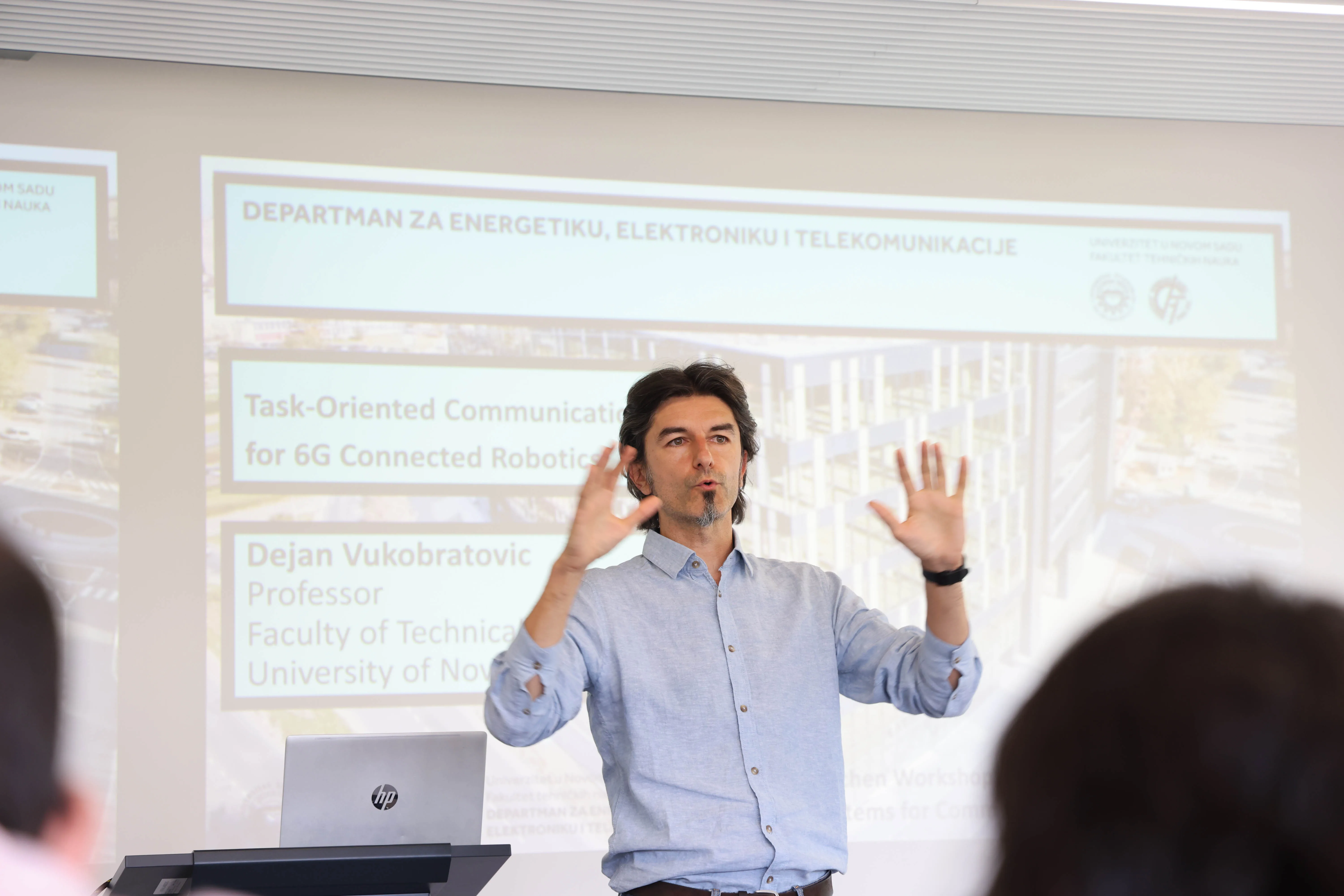 An invited speaker presents research on task-oriented communications for connected robotics.